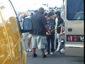 In front of the tour bus..