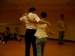 Bosson practicing salsa with Lilian