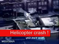 Helicopter crashes on to a building