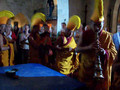 Tibetan Monks Carrying Dismantled Mandala to Clean Stream