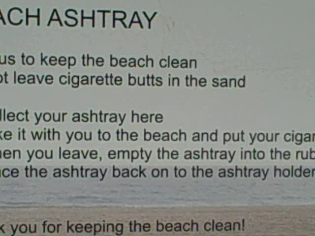 Albufeira beach review shows sign asking smokers to clean up