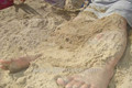Virginia Beach travel: Buried in the sand on Sandbridge Beach . 