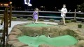 Max and Molly Playing Mini Golf