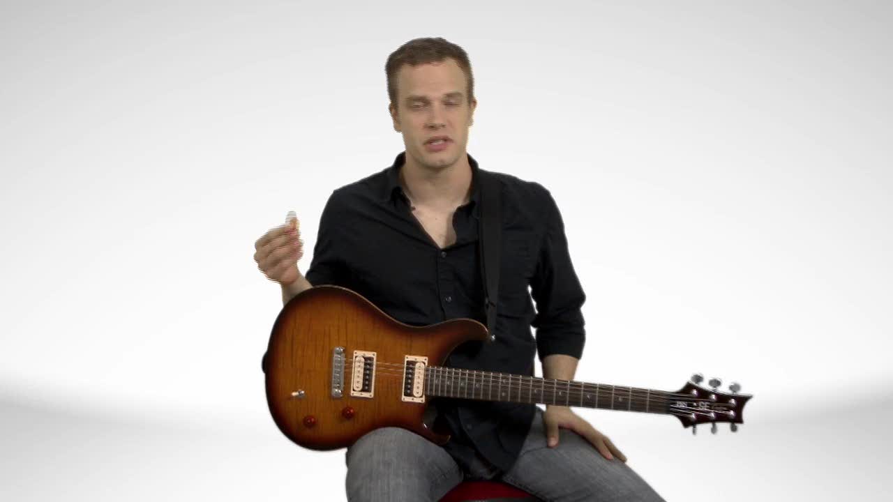 How To Hold An Electric Guitar - Guitar Lessons