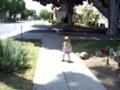 Baby Sarah Nicole walking down sidewalk, spinning & saying daddy