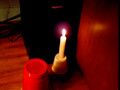 Candle in front of a sub with music playing