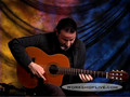 Tomas Cataldo jams on acoustic guitar