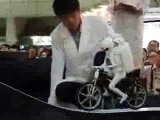 robot riding bicycle