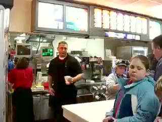 Principal, teacher, administrator put on McDonald's aprons 